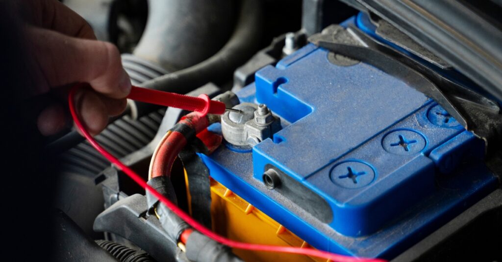 test car battery with multimeter